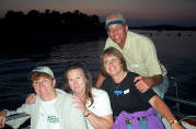 Inge Drozd, Lt/C Alison Varian, P, Linda and Ken Ripley pose on the upper deck of the Sea Mist.