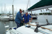 NHPS member Inge Drozd helps Gil with an inflatable life jacket